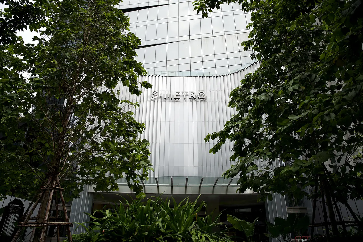The S-Metro Building on Sukhumvit Road, seen through the trees
